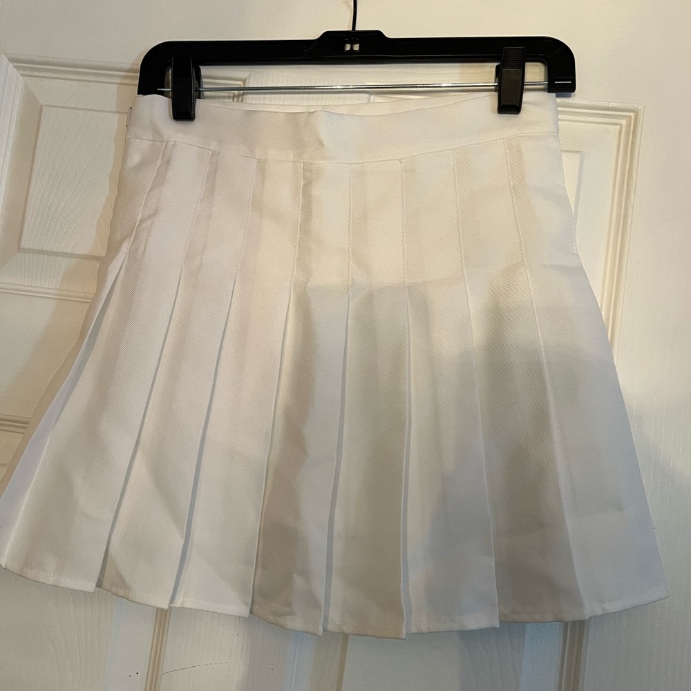 This white skirt comes with shorts underneath (skort) runs a little small